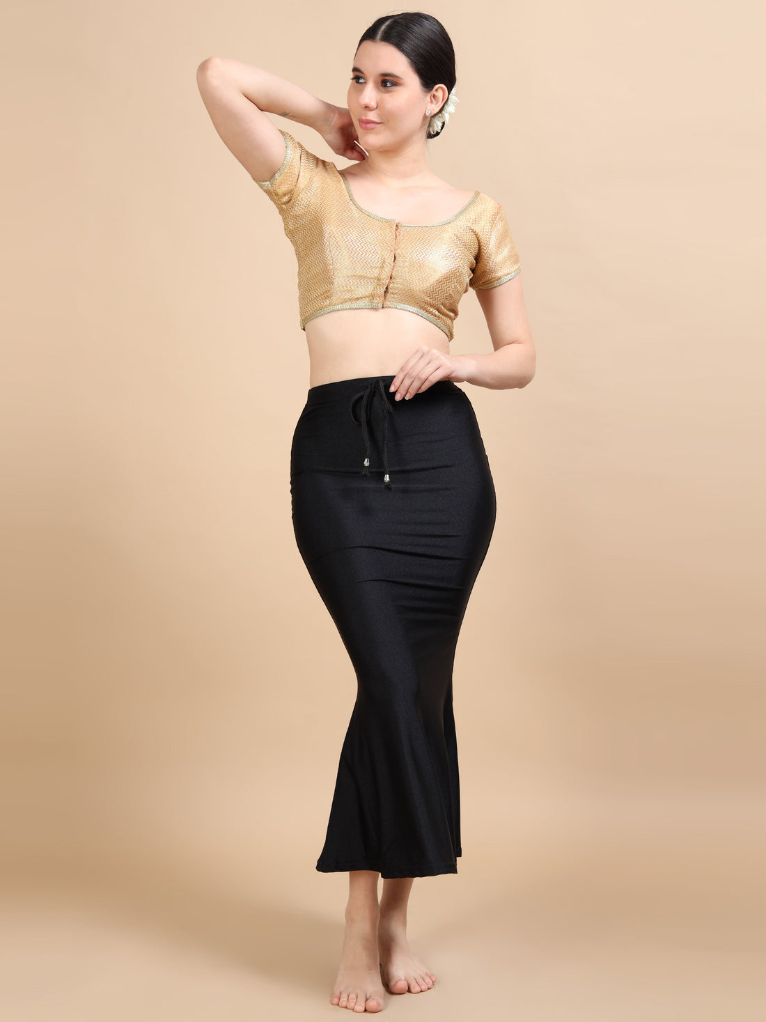 Saree shapewear worn under different outfits including a lehenga and gown for a smooth silhouette
