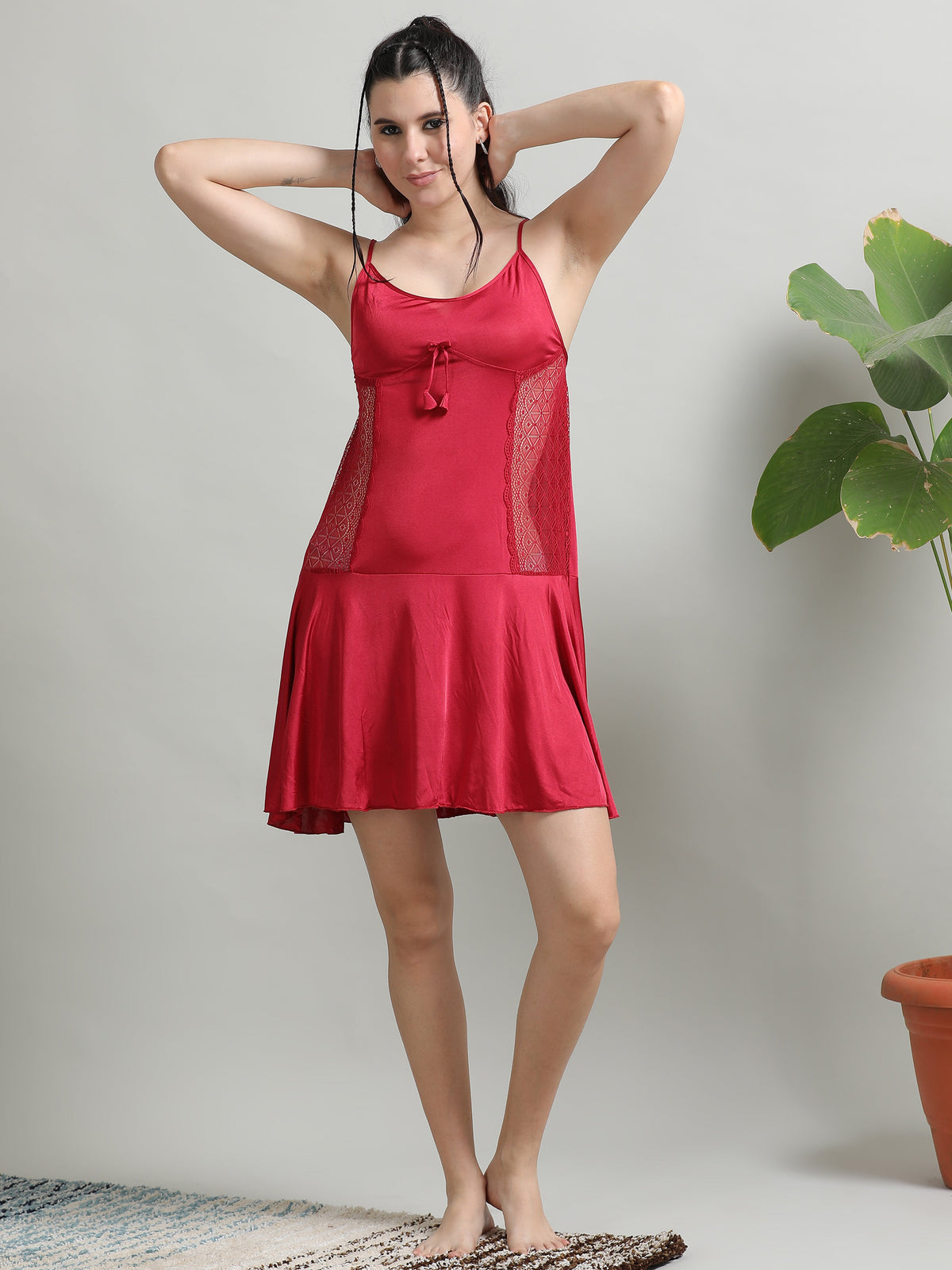 Woman styling a satin babydoll dress with a robe for a confident look — Ecstasy